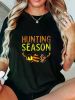 Holiday Cheer] Women's Hunting Season Graphic T-Shirt - Soft Crew Neck Short Sleeve Tee with Deer & Egg Hunt Design